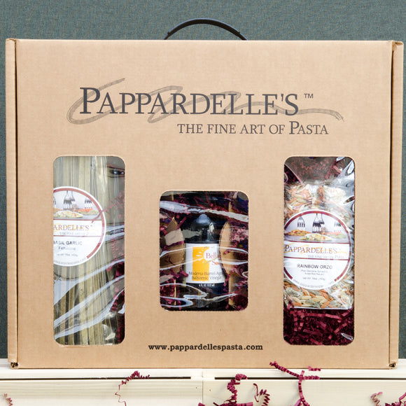 Pappardelle’s gift box containing an assortment of packaged artisan pastas and gourmet sauce.